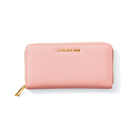 Sleek pink wallet on a pastel gradient background with subtle gold accents, a red ribbon, and a small Chinese coin symbolizing Feng Shui prosperity and wealth.