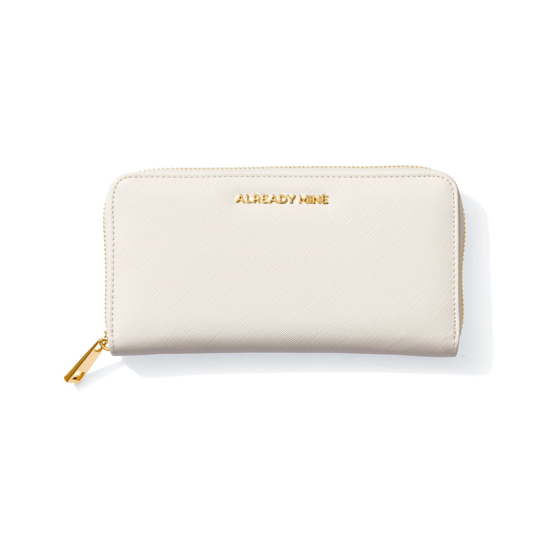 Luxury Ecru Manifesting Wallet with golden "ALREADY MINE" affirmation logo.