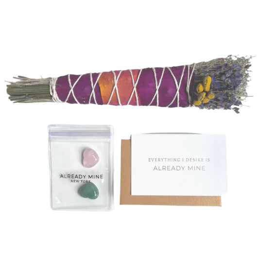 Hand-wrapped floral sage bundle with dried flowers, lavender, and manifestation crystals for energy cleansing.