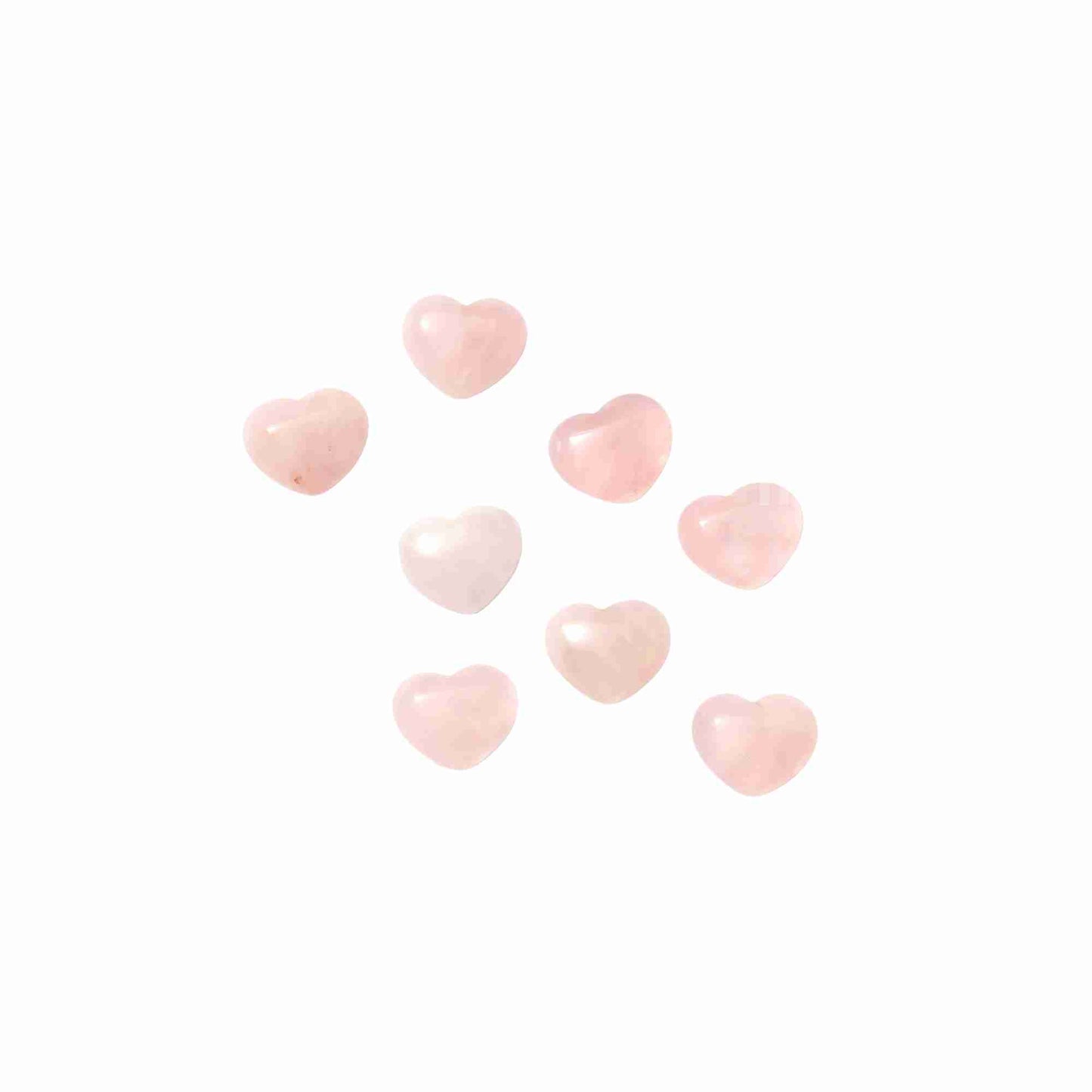 Polished Rose Quartz heart crystal, symbolizing love and emotional healing.